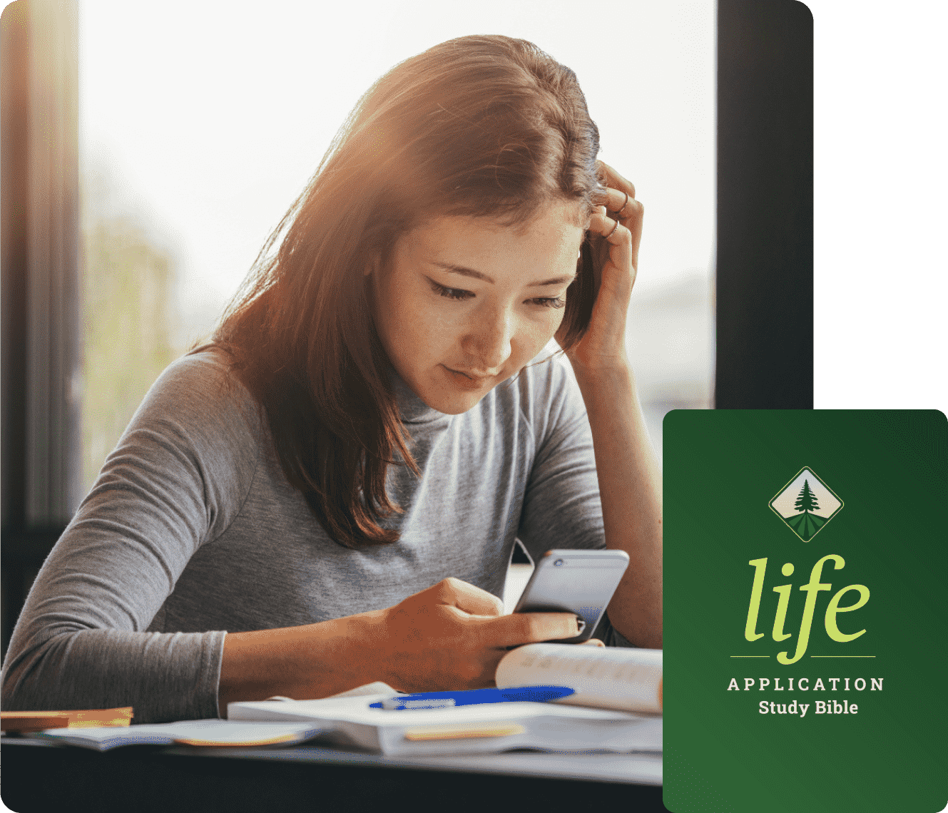 a girl reading the Life Application Study Bible